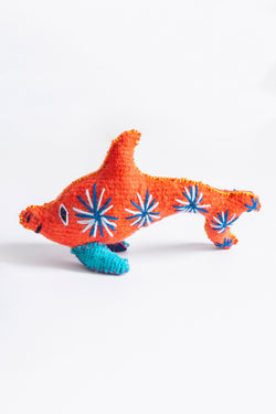 Colorful felt dolphin plush toy with hand embroidered features and designs.