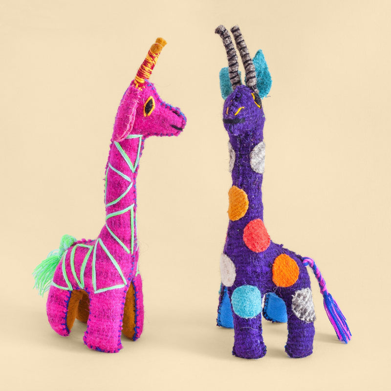 Two colorful felt giraffe plush toys with hand embroidered features and designs.